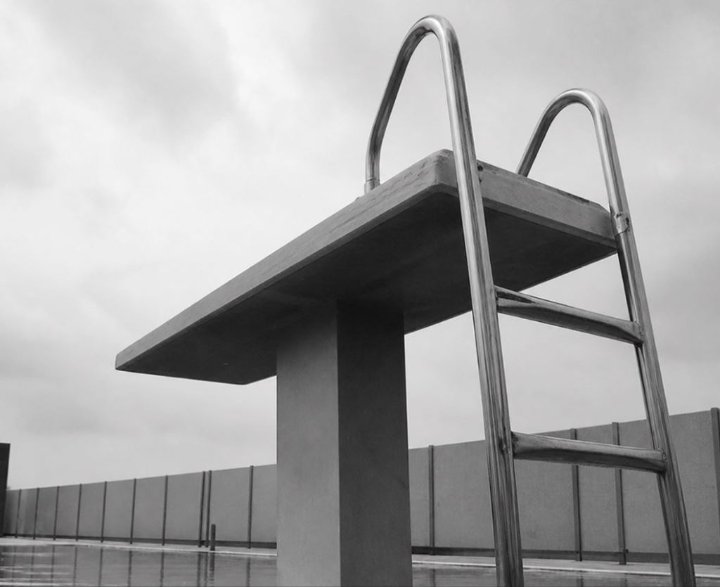 diving board at pool black and white ny 2
